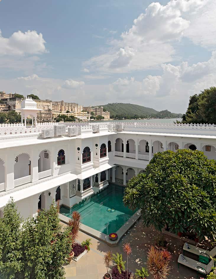 Courtyard pool below arcades with the lake beyond
