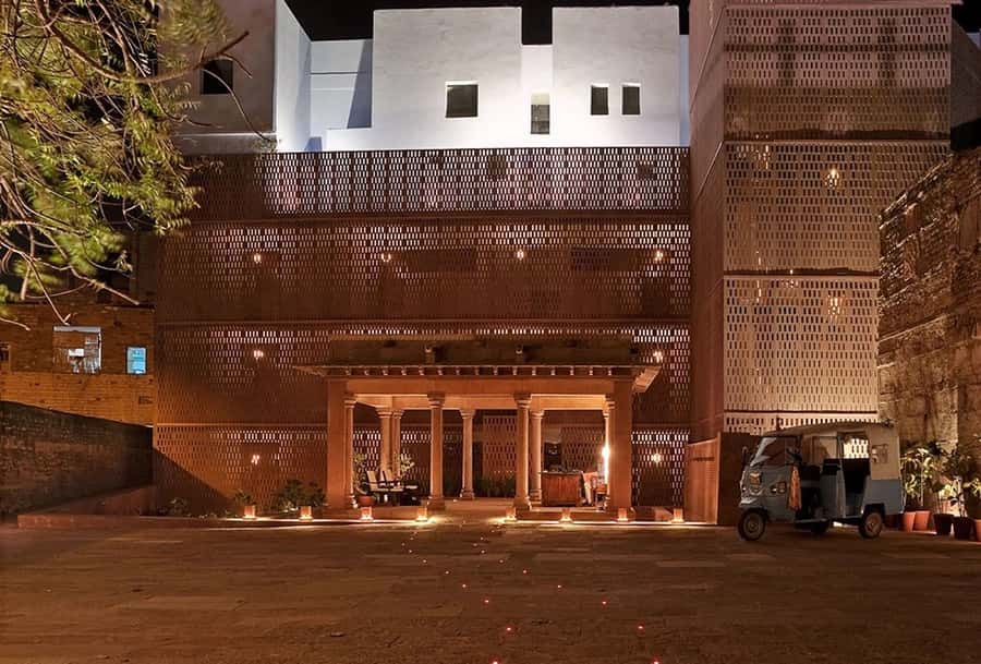Lattice screen entrance lit at dusk