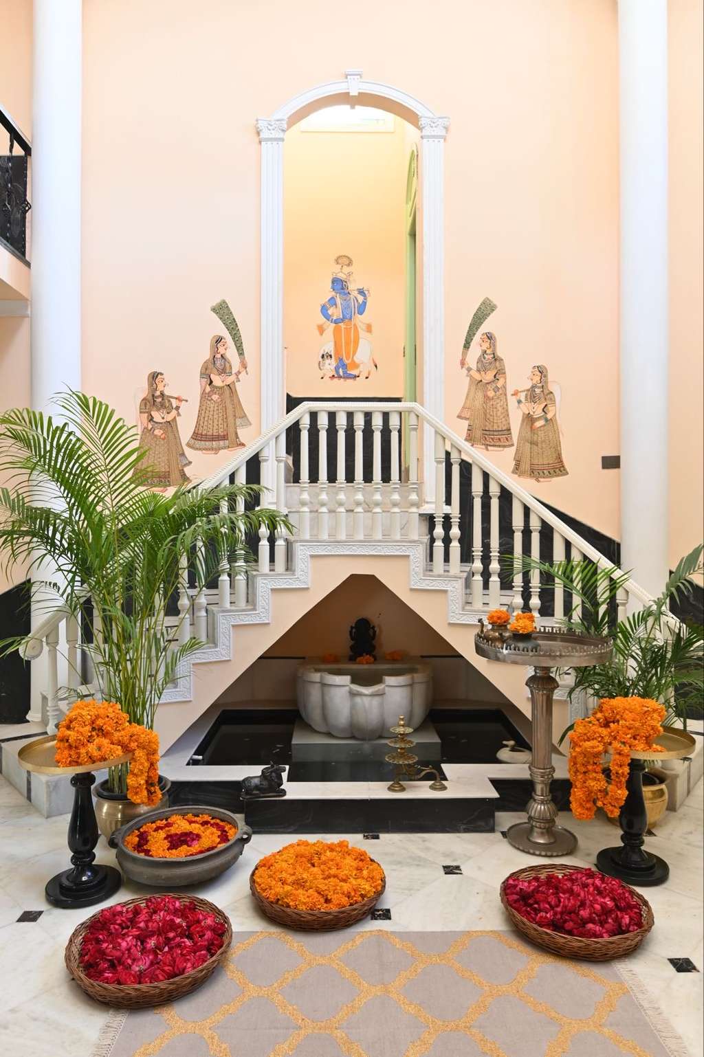 Painted entrance hall with marigolds and staircase