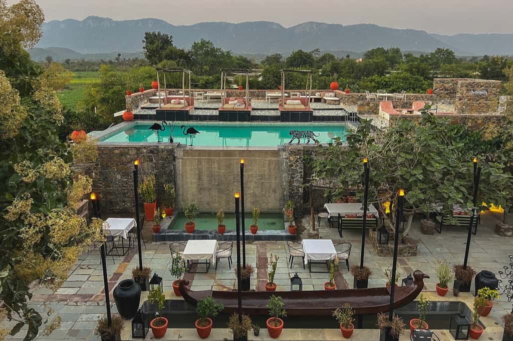 Pool terrace and dining courtyard below the Aravalli hills