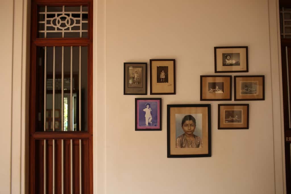 Wall of framed family portraits