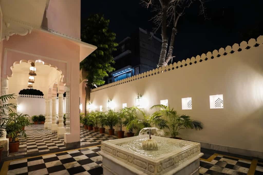 Marble fountain and chequered courtyard at Dev Mahal, Jaipur, at night