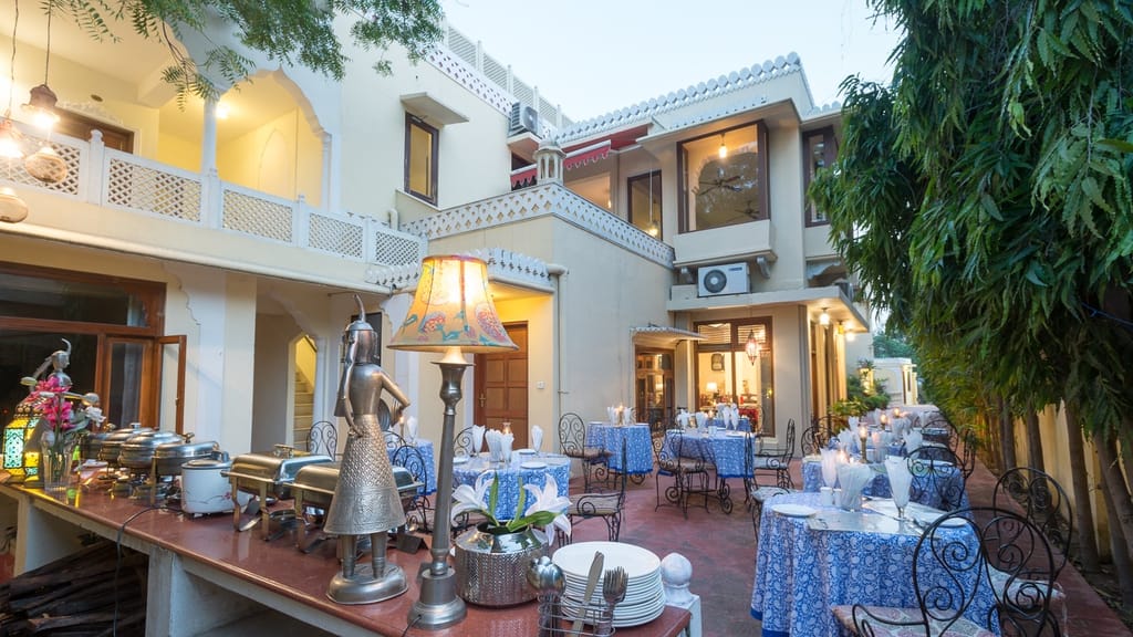 Evening dining laid out in the garden courtyard, Dera Rawatsar, Jaipur