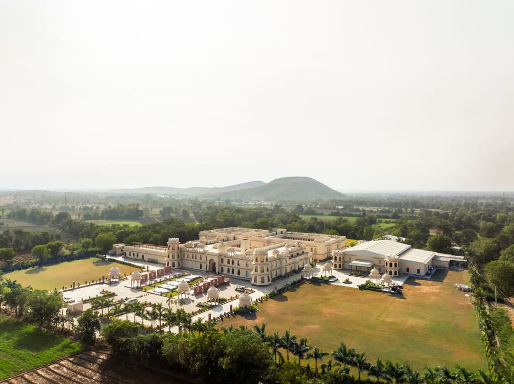 Aerial drone view of the palace-style resort and grounds by day, Kesar Bagh Palace, Chittorgarh