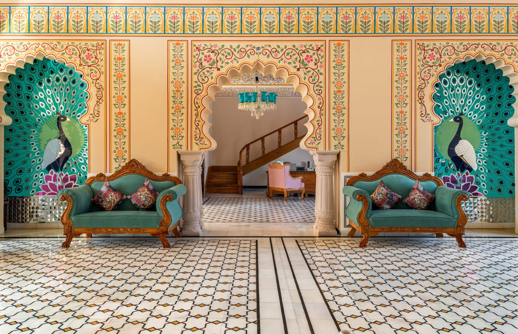 Main lobby with chandeliers and hand-painted detailing, Kesar Bagh Palace, Chittorgarh