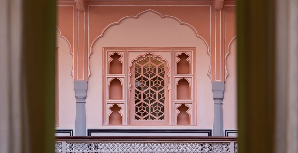 Rose-pink arches, niches and jaali screen of the haveli's courtyard facade, Padmaa, Jaipur