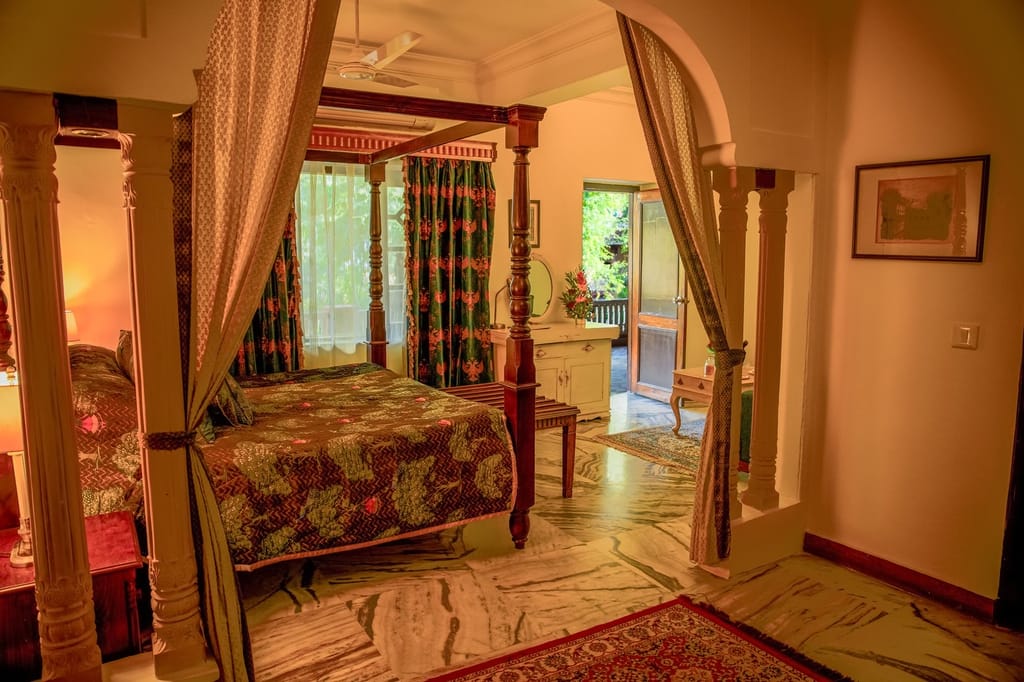 Luxury Suite bedroom with four-poster bed and marble floor, Ranbanka Palace, Jodhpur