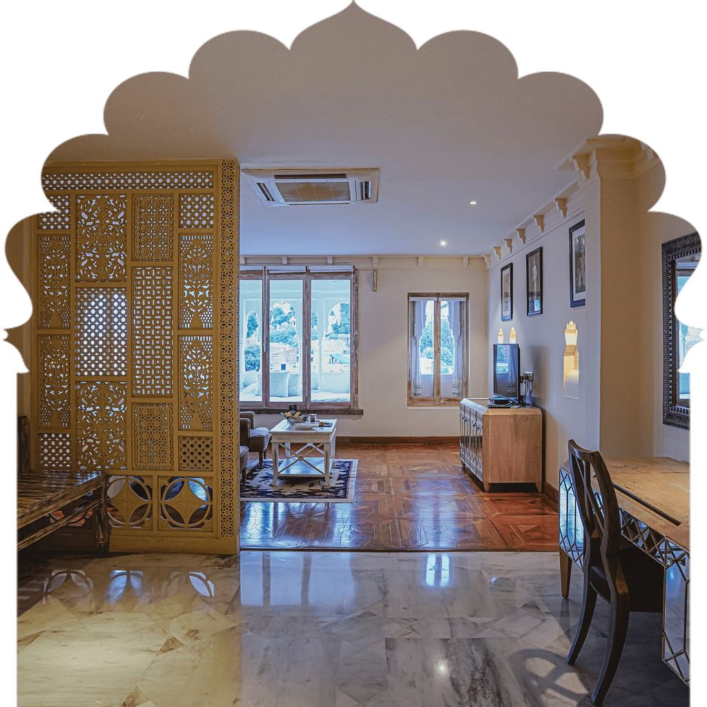 Suite living area behind a carved jali screen with village views, Rawla Narlai, Narlai