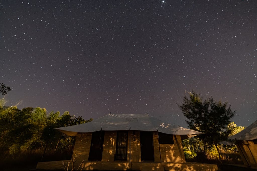 Luxury tent beneath a star-filled night sky, Soulacia Hotel & Resort, Kanha