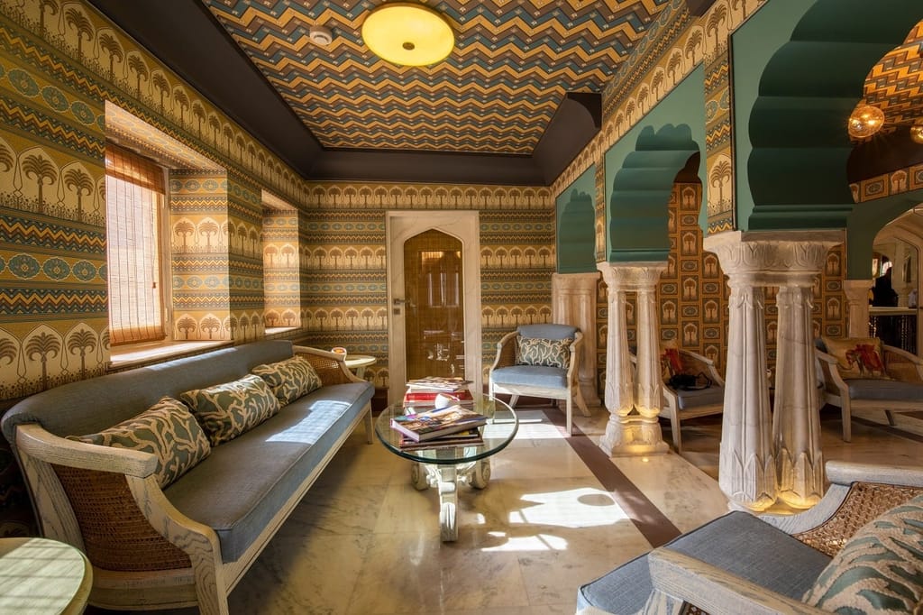 Sitting lounge with carved pillars and patterned ceiling, Surya Haveli, Jaipur