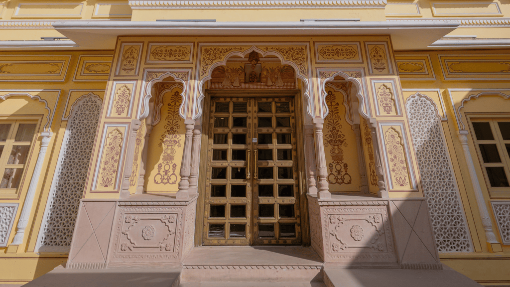 Carved jharokha window on the sunlit facade