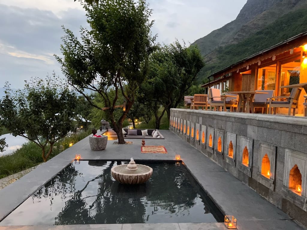 Qayaam Gah infinity pool at dusk