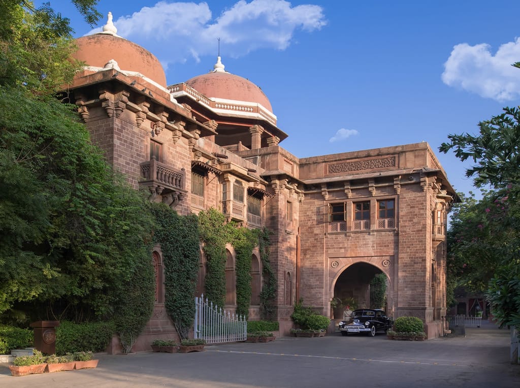 Red sandstone facade with domed roofline