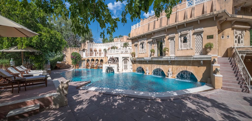 Swimming pool below the arcaded palace