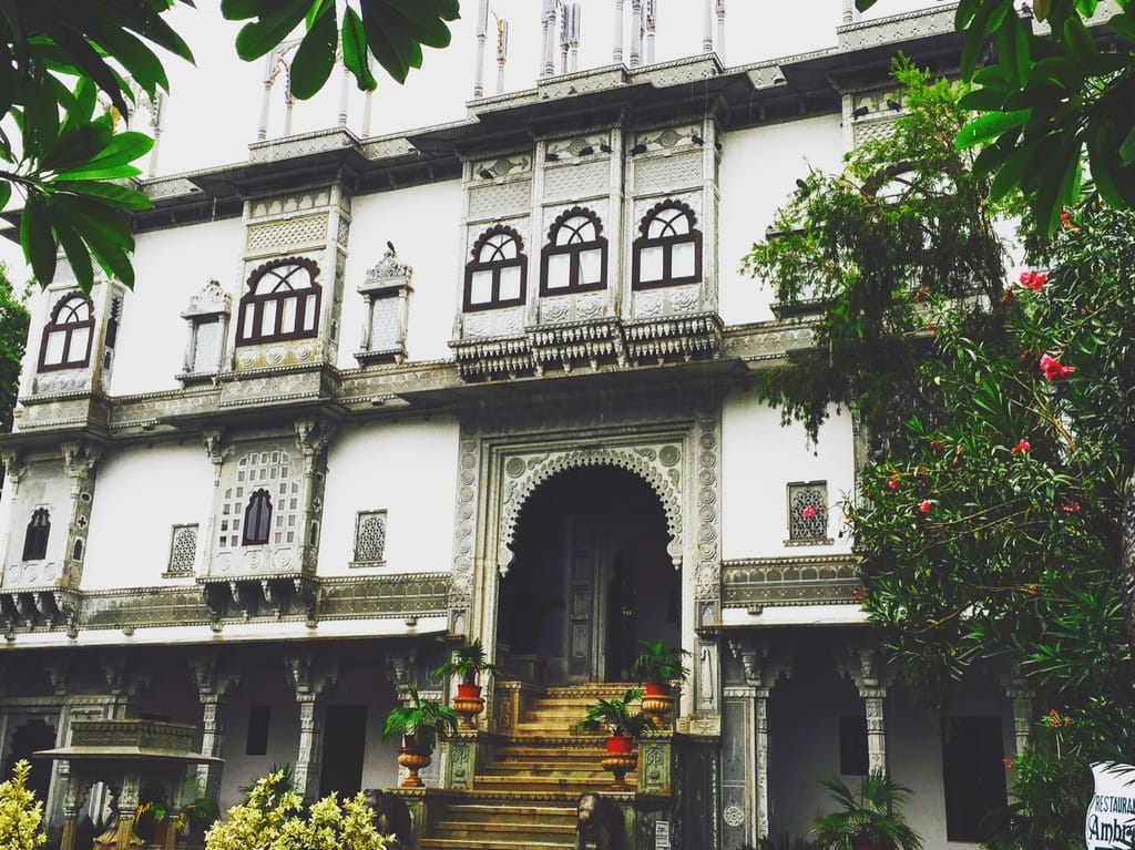 Carved white facade above the entrance steps