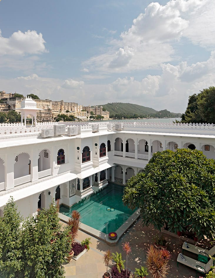 Courtyard pool below arcades with the lake beyond