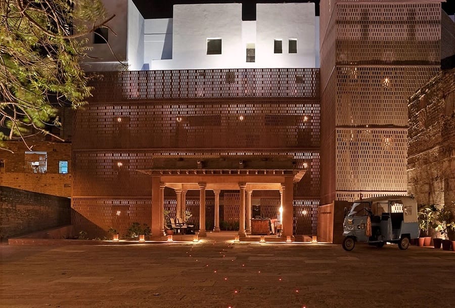 Lattice screen entrance lit at dusk