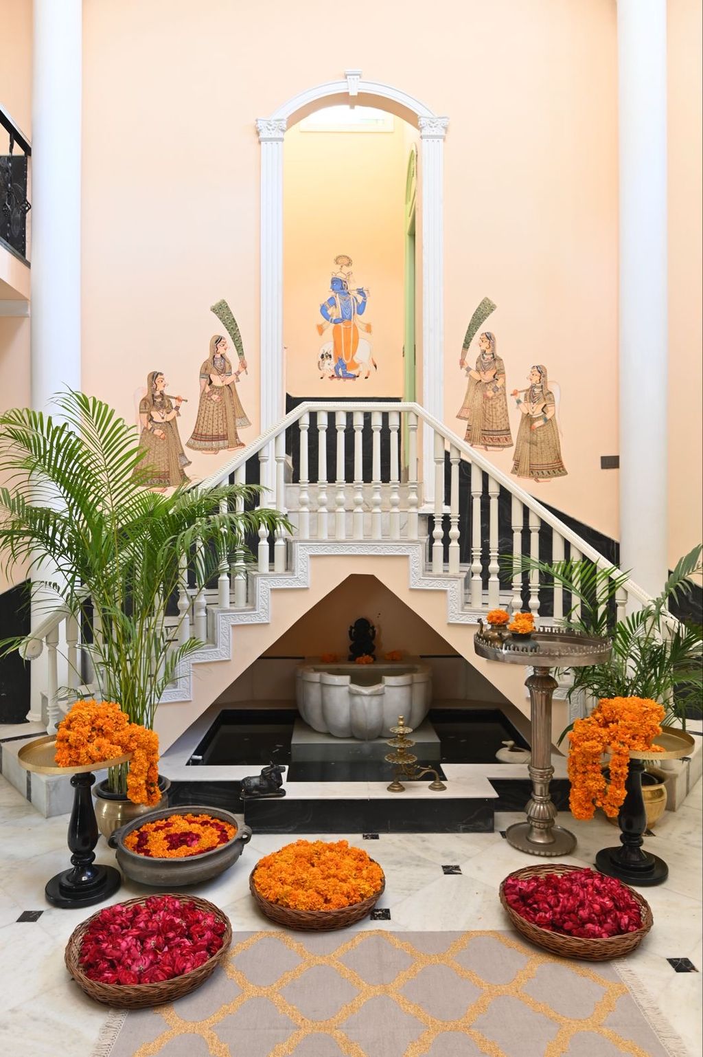 Painted entrance hall with marigolds and staircase