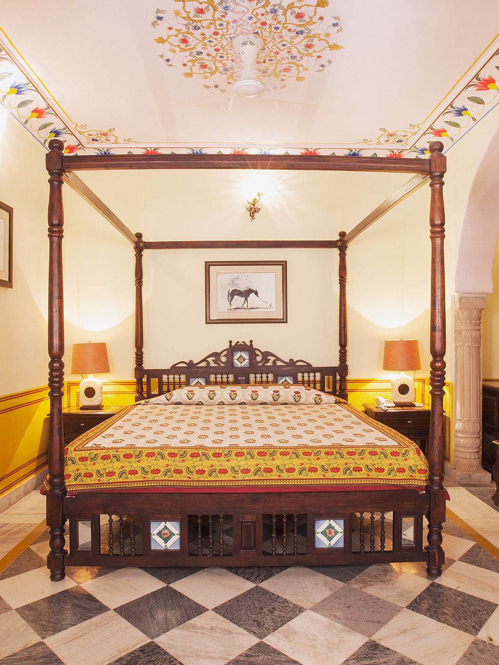 Four poster bed on marble floor