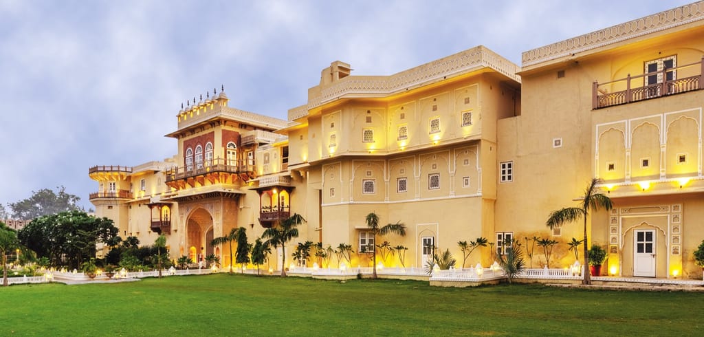 Palace facade above lawn in daylight