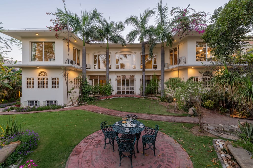 The villa around its lawn and patio