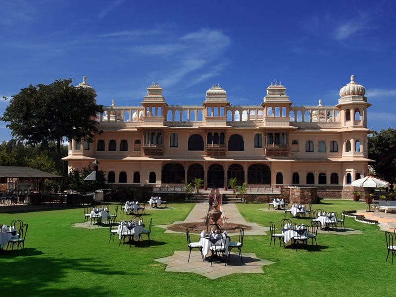 Palace facade and lawn under blue sky