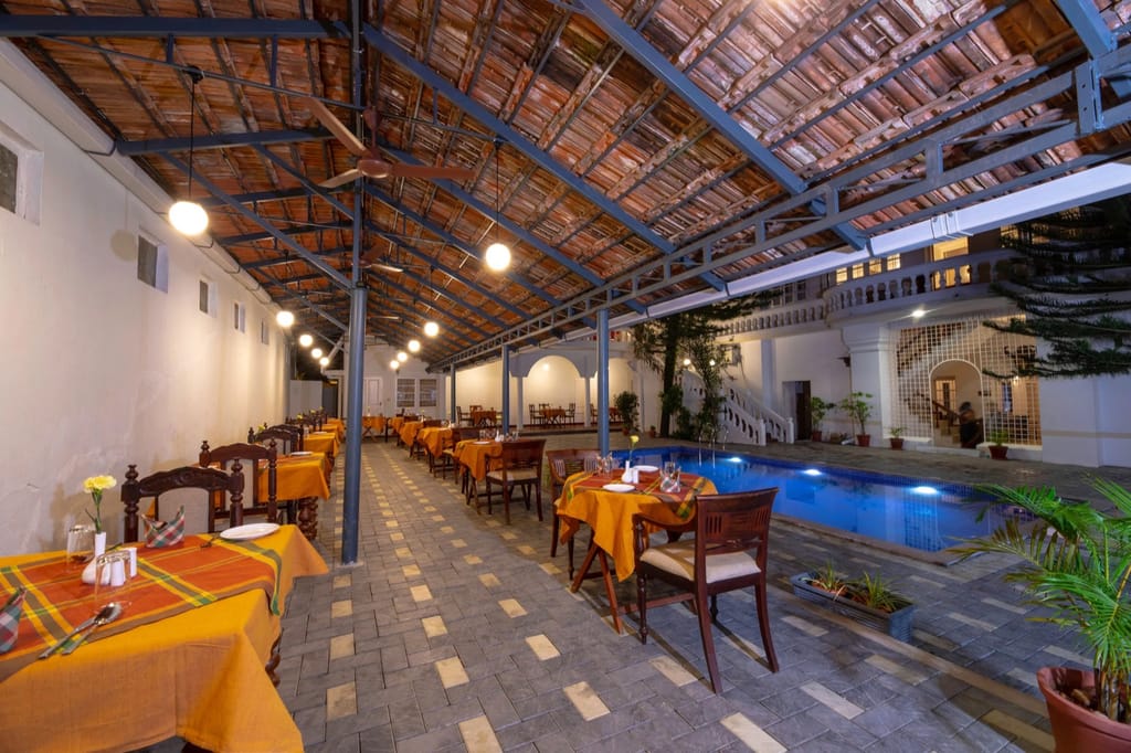 Food Mill tables set beside the pool