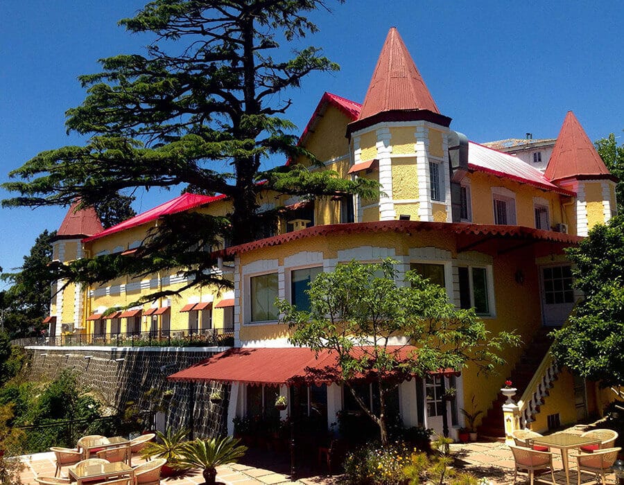 Palace seen across the garden with parasols