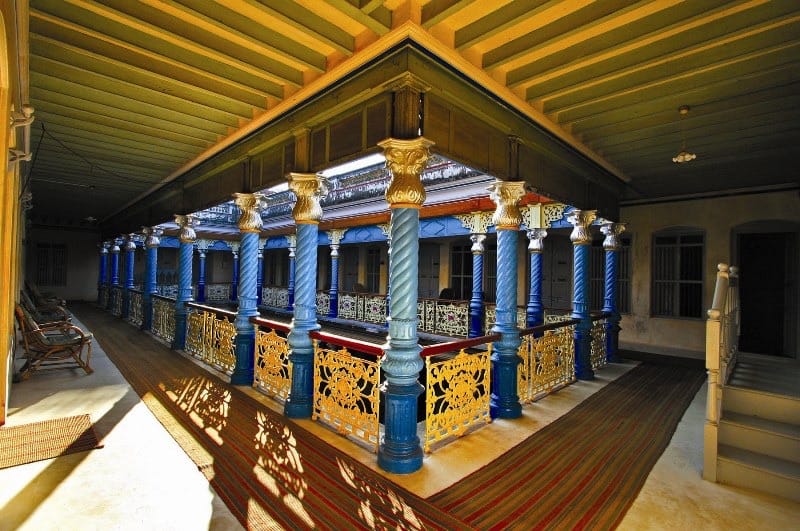 Upper gallery with blue columns and gilded capitals
