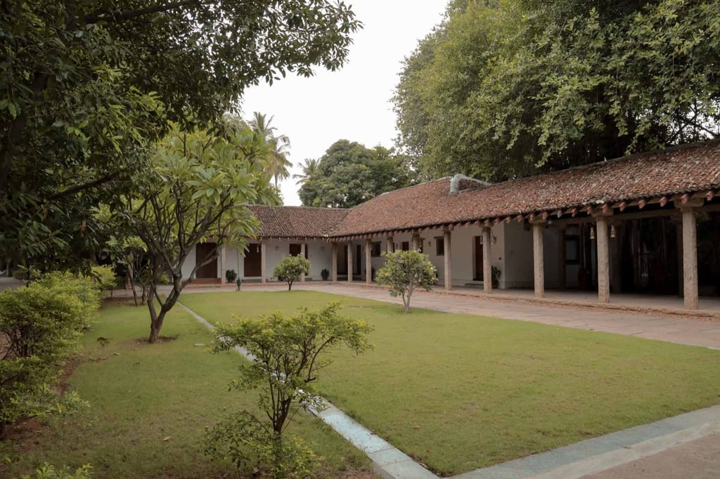 Long tiled-roof wing across a lawn