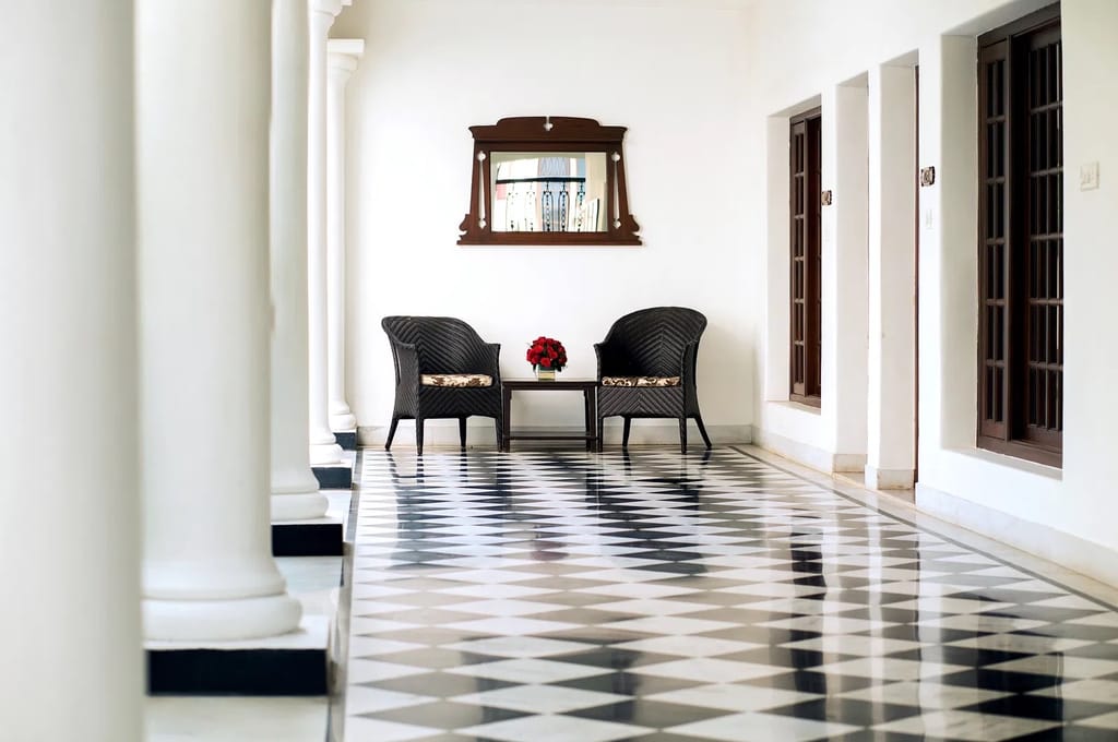 Arched corridor with chequered stone floor