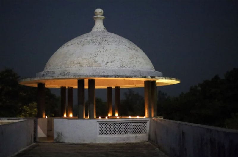 Domed garden pavilion lit at night