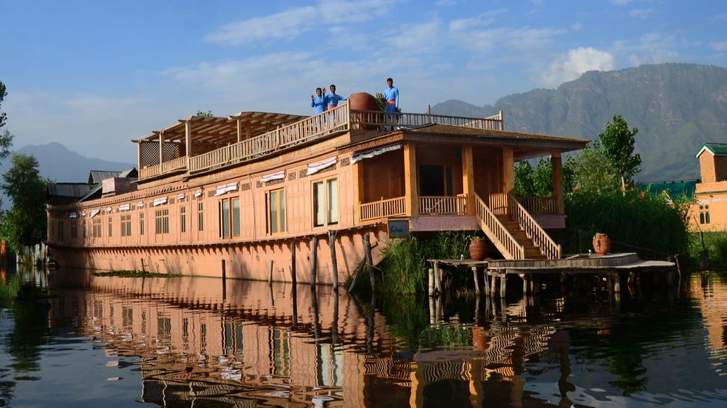 The houseboat moored on Dal Lake below the mountains