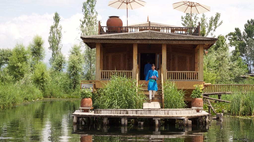 Carved wooden pavilion end seen from the water