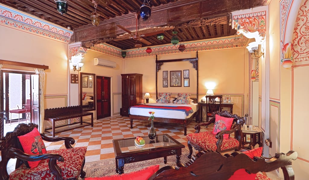 Bedroom with red chequered floor and painted walls
