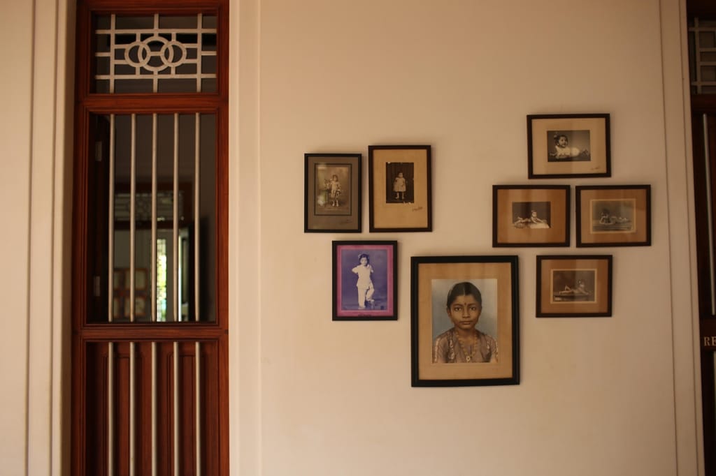 Wall of framed family portraits