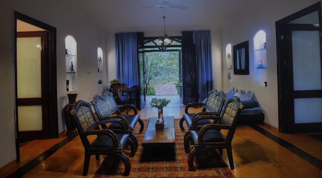 The sitting room of a suite, opening to the garden