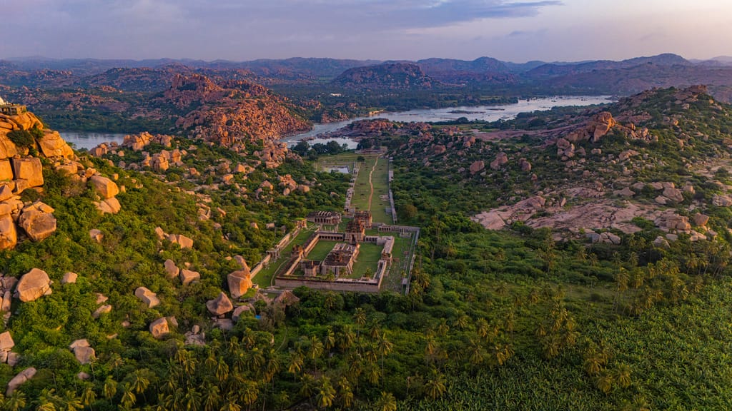 The Hampi ruins from the air, with lake and wildflowers