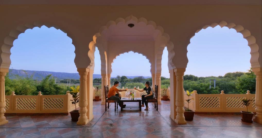 Tea on the arched terrace with the fields and hills beyond