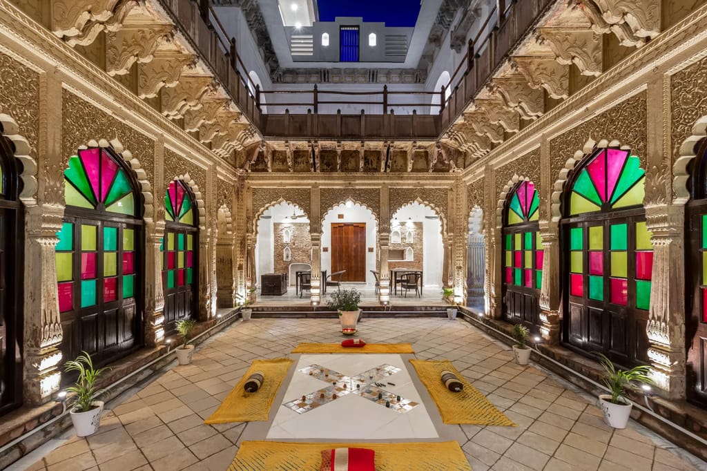 Courtyard with stained-glass doors and carved arches