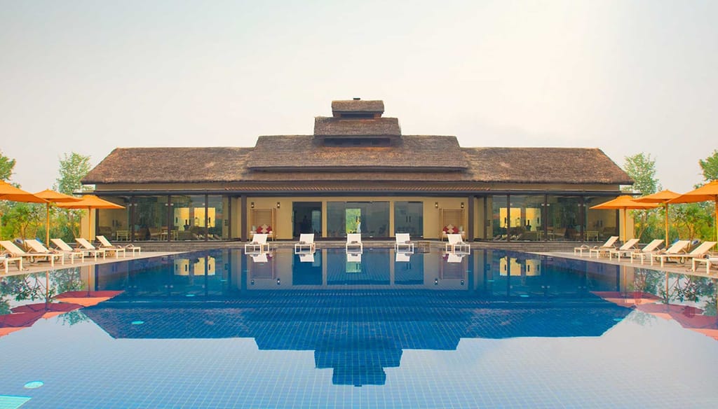 Sunlit pool deck with a tranquil ambiance