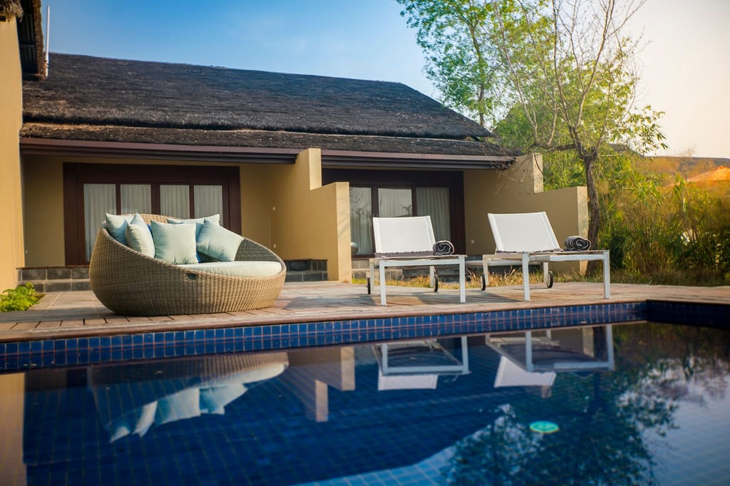 Inviting poolside oasis with lounge chairs