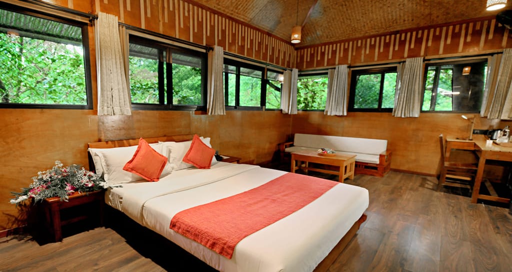Family Tree House bedroom with king bed, woven ceiling and windows onto the forest, Vythiri Resort, Vythiri