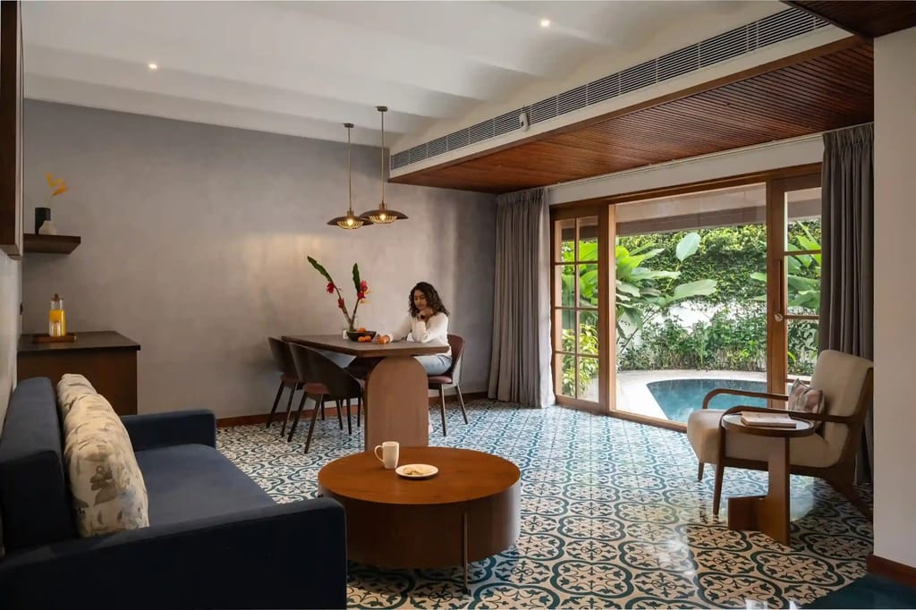 Private Pool Villa living room with patterned tile floor opening onto the private plunge pool, Coco Lagoon by Great Mount, Pollachi