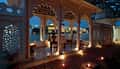 The candlelit terrace of a Lake Facing Suite at dusk
