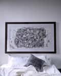 The artwork over the bed in a Heritage Wing room at Kara