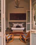 A Modern Wing room at Kara, the bed seen through the garden doors