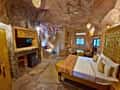 Inside a cave room at Tathastu Pench, the bed set into the rock
