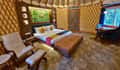 Inside a yurt at Tathastu Kanha, the bed under the lattice roof