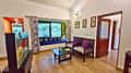 The sitting area of a cottage at Tathastu Kanha